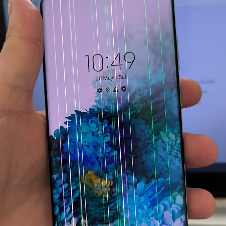 Samsung phone screen displaying vertical flickering lines